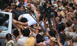 The Leader of Opposition in india being detained by the police amid a massive protest